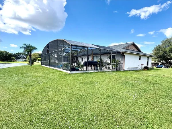 a view of a house with a big yard
