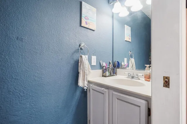 a utility room with stainless steel appliances washer and dryer