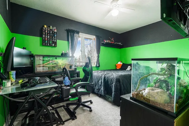 a bed sitting in a room next to a window