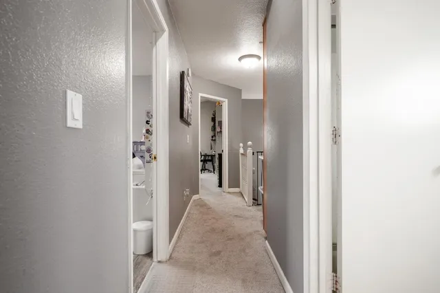 a bedroom with a bed and a table in it