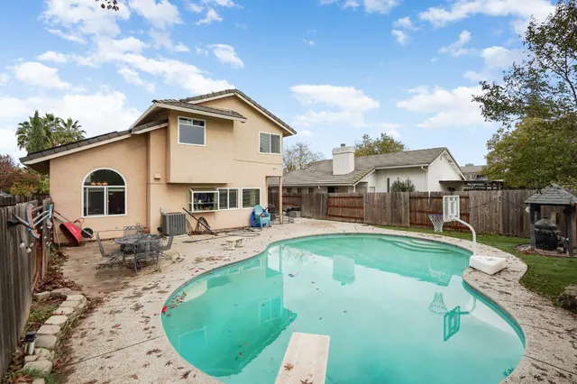 a view of a house with swimming pool