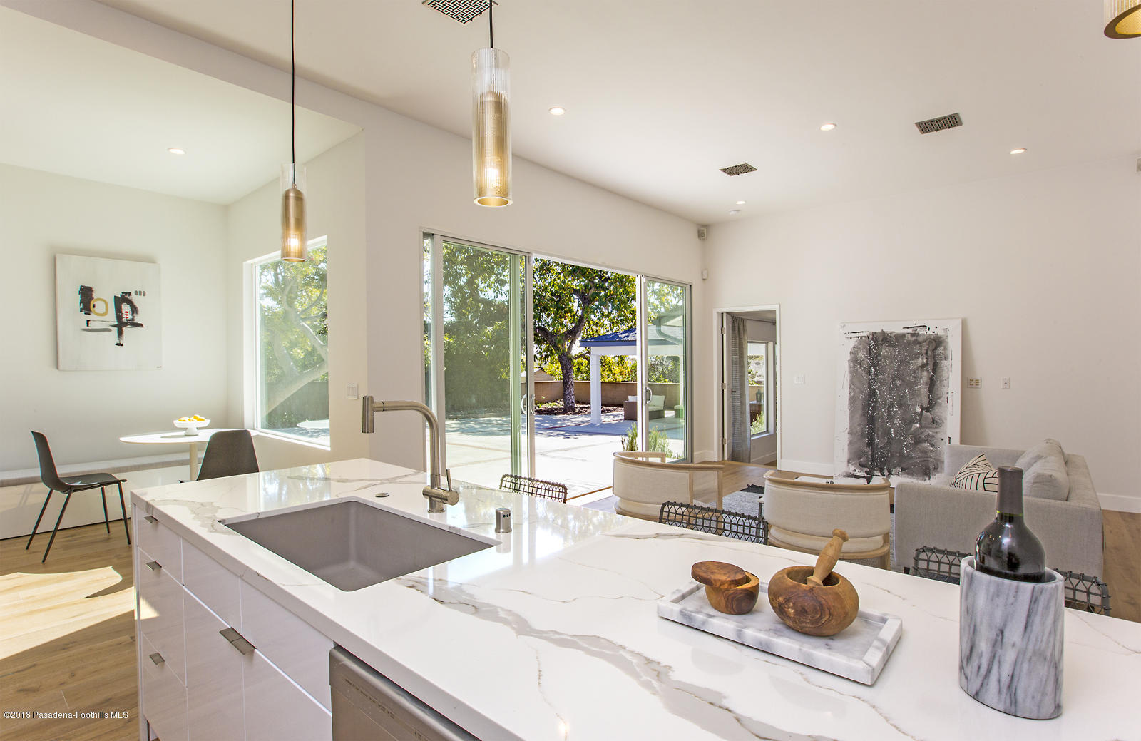 3700 Fairmeade Road Pasadena, CA 91107 - Photo 14 of 35 a kitchen with a sink a counter and chairs