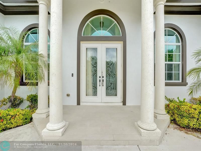 1965 Park Place Boca Raton, FL 33486 - Photo 1 of 30 a front view of a house with garden