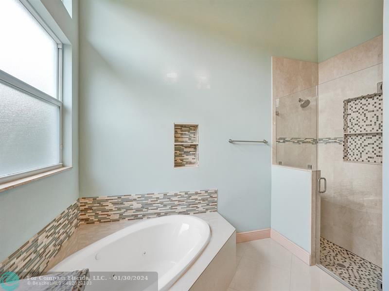 1965 Park Place Boca Raton, FL 33486 - Photo 18 of 30 a bathroom with a bathtub and shower