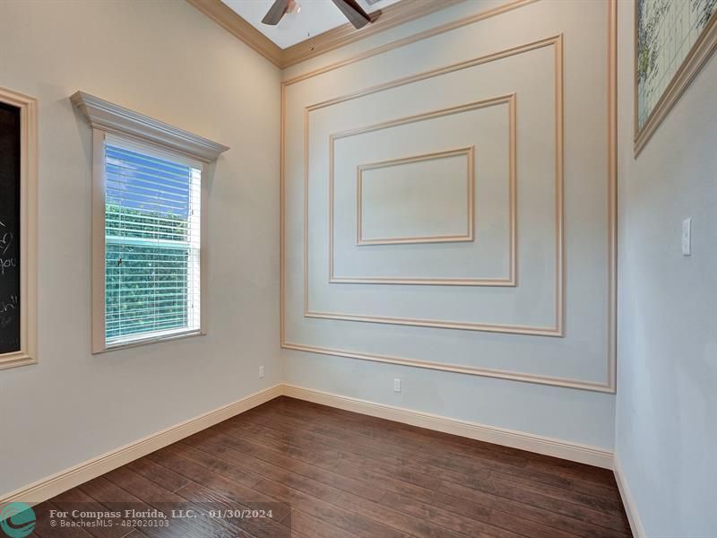 1965 Park Place Boca Raton, FL 33486 - Photo 19 of 30 a view of an empty room with wooden floor and a window