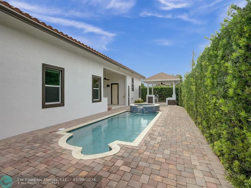 1965 Park Place Boca Raton, FL 33486 - Photo 27 of 30 a view of a house with swimming pool