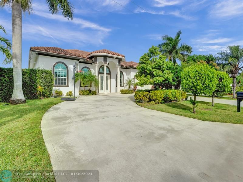 1965 Park Place Boca Raton, FL 33486 - Photo 30 of 30 front view of a house with a yard