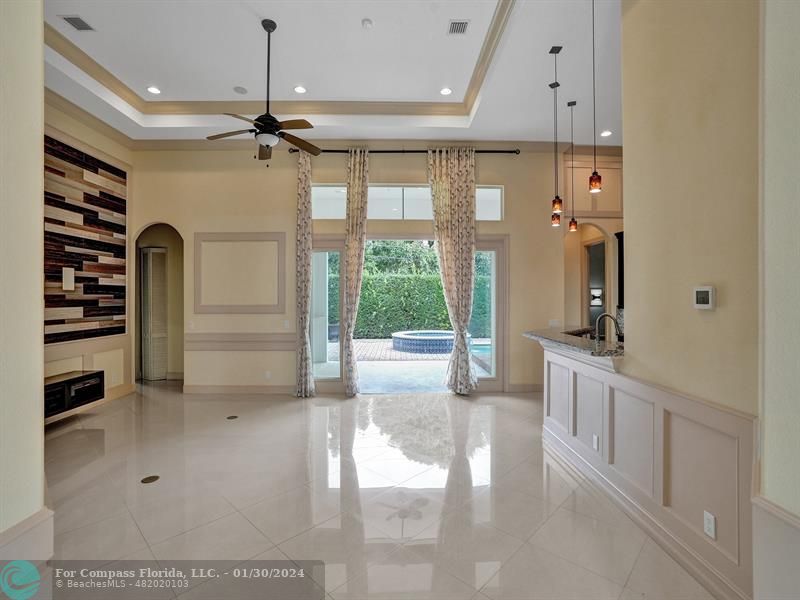 1965 Park Place Boca Raton, FL 33486 - Photo 3 of 30 a open kitchen with white cabinets and a stove