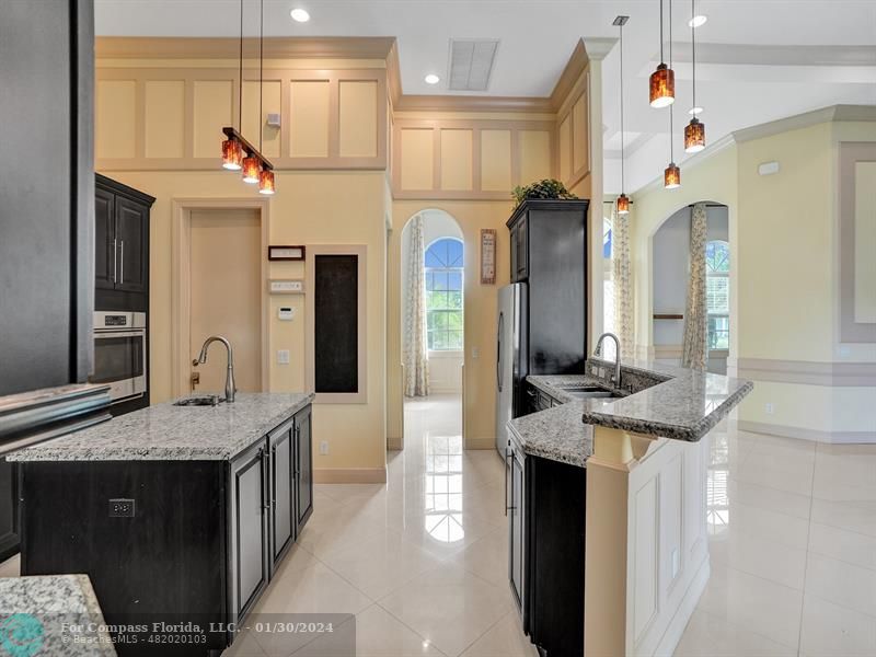 1965 Park Place Boca Raton, FL 33486 - Photo 10 of 30 a bathroom with a granite countertop sink a large mirror and a shower