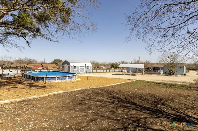 a view of a swimming pool with an ocean view