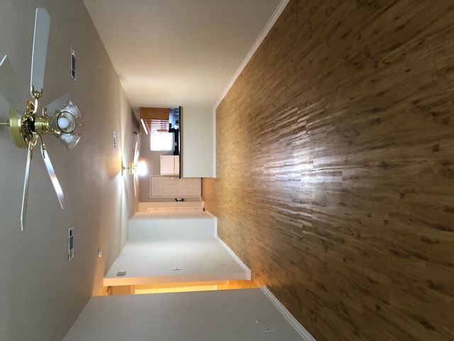 908 Willow Pond Street College Station, TX 77845 - Photo 2 of 7 wooden floor in an empty room with a window