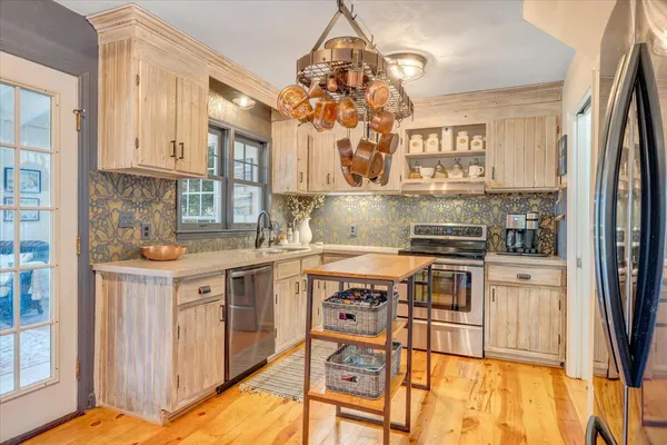 a kitchen with a sink and cabinets