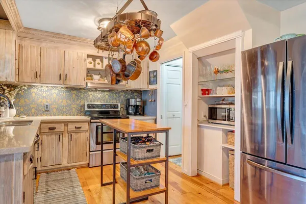 a living room with furniture large window and a table