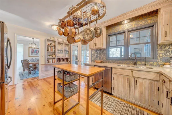 a view of a balcony with wooden floor and fence