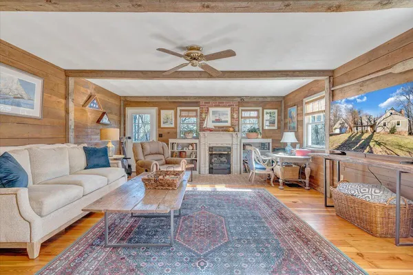 a bathroom with a toilet a sink a vanity and mirror
