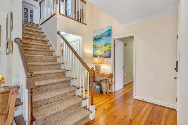 a backyard of a house with barbeque oven table and chairs