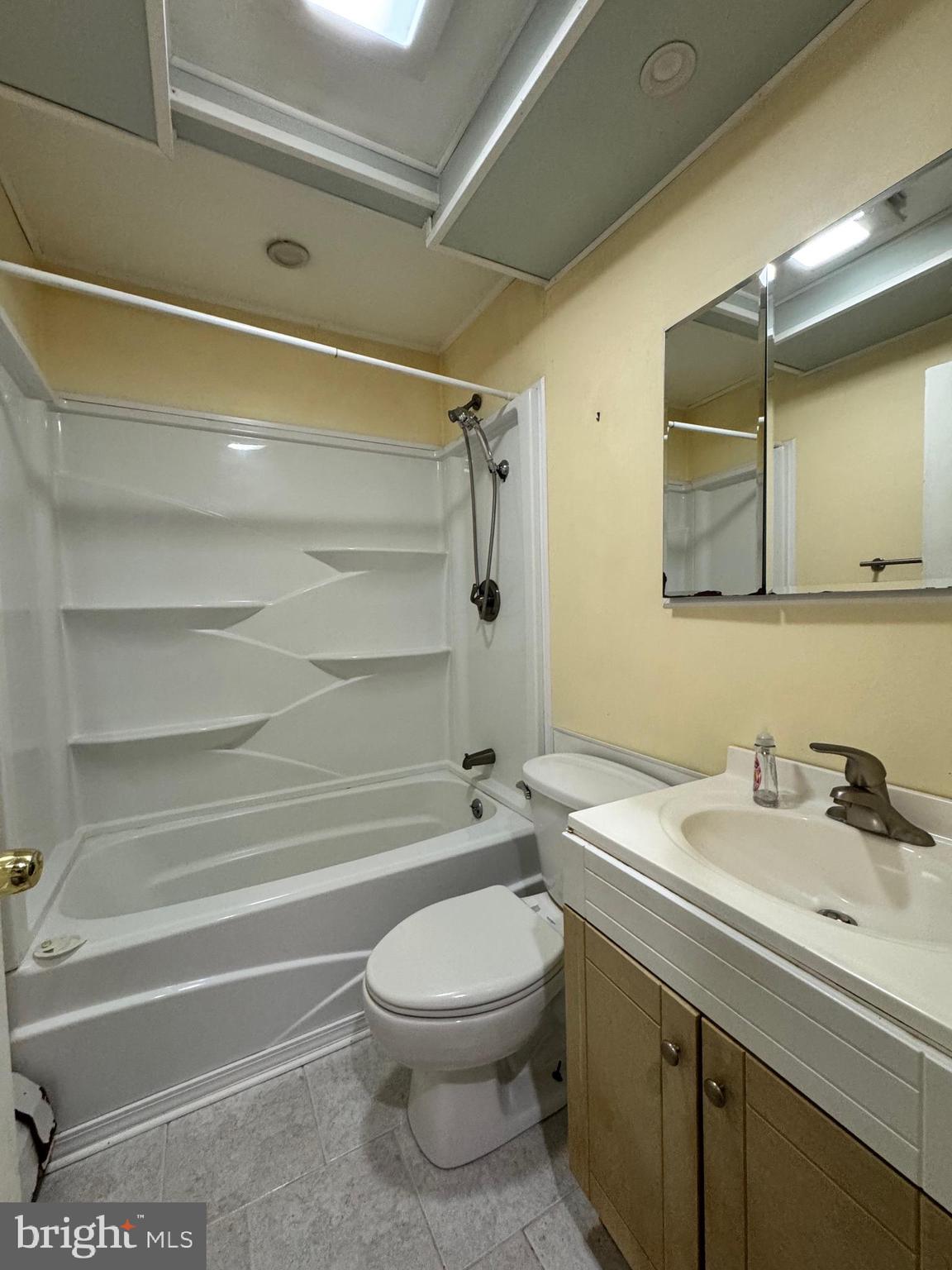31 Swan Lane Levittown, PA 19055 - Photo 11 of 17 a bathroom with a sink a toilet and shower