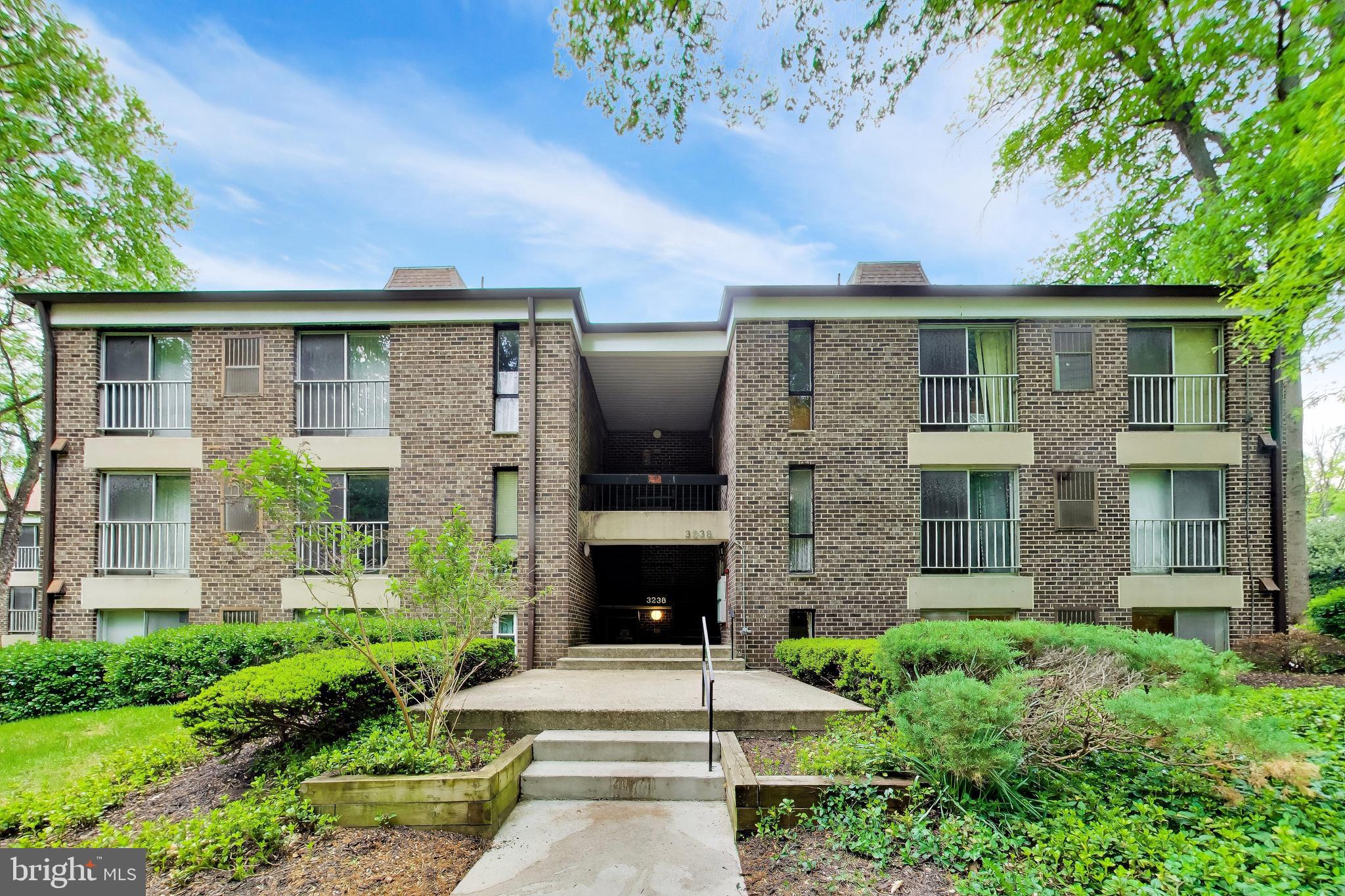 3238 Hewitt Avenue, Unit 51B Silver Spring, MD 20906 - Photo 1 of 1 a front view of a house with a garden