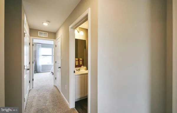 a view of a hallway with toilet