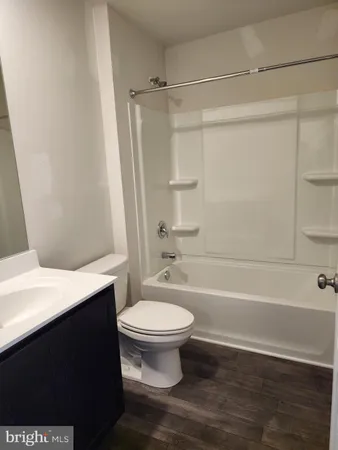 a bathroom with a sink a toilet and a bathtub