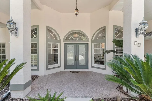 a kitchen with stainless steel appliances granite countertop a sink and a refrigerator
