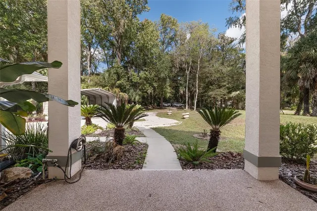 a kitchen with stainless steel appliances a stove sink microwave and cabinets