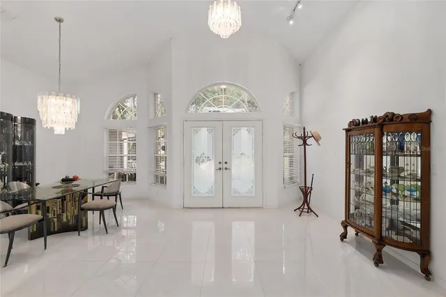 a view of a dining room with furniture and a window