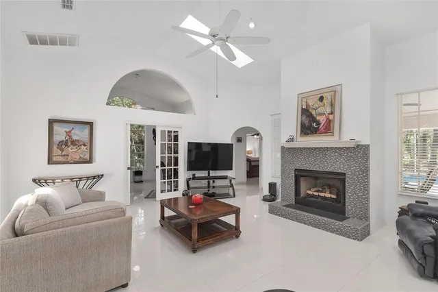 a bathroom with a granite countertop sink mirror vanity and toilet