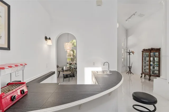 a view of a house with backyard porch and sitting area