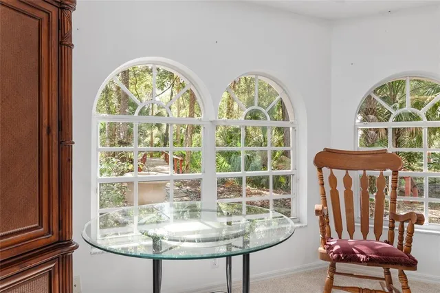 a view of a wooden deck next to a yard