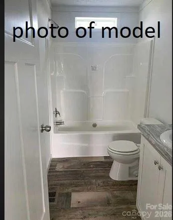 a bathroom with a toilet and a sink