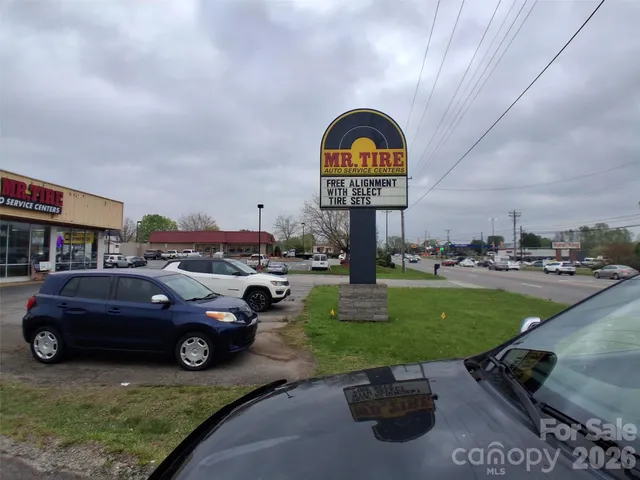 a view of a car in front of a building