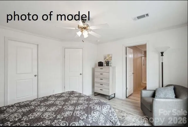 a bedroom with a bed and closet