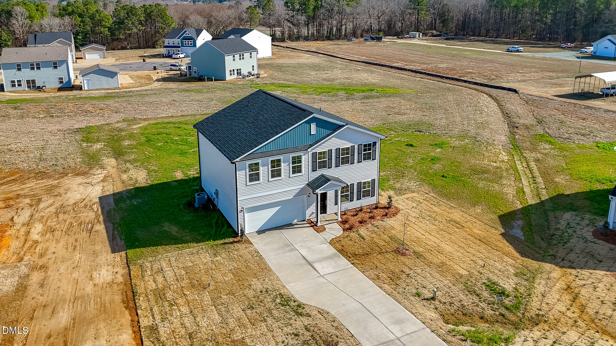79 Osgood Street Angier, NC 27501 - Photo 2 of 31 a view of a house with a yard and trees