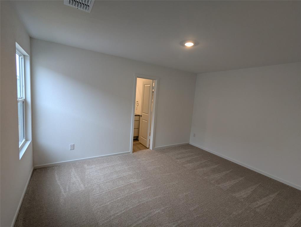 904 Wood Stork Way Princeton, TX 75407 - Photo 15 of 40 an empty room with closet and windows