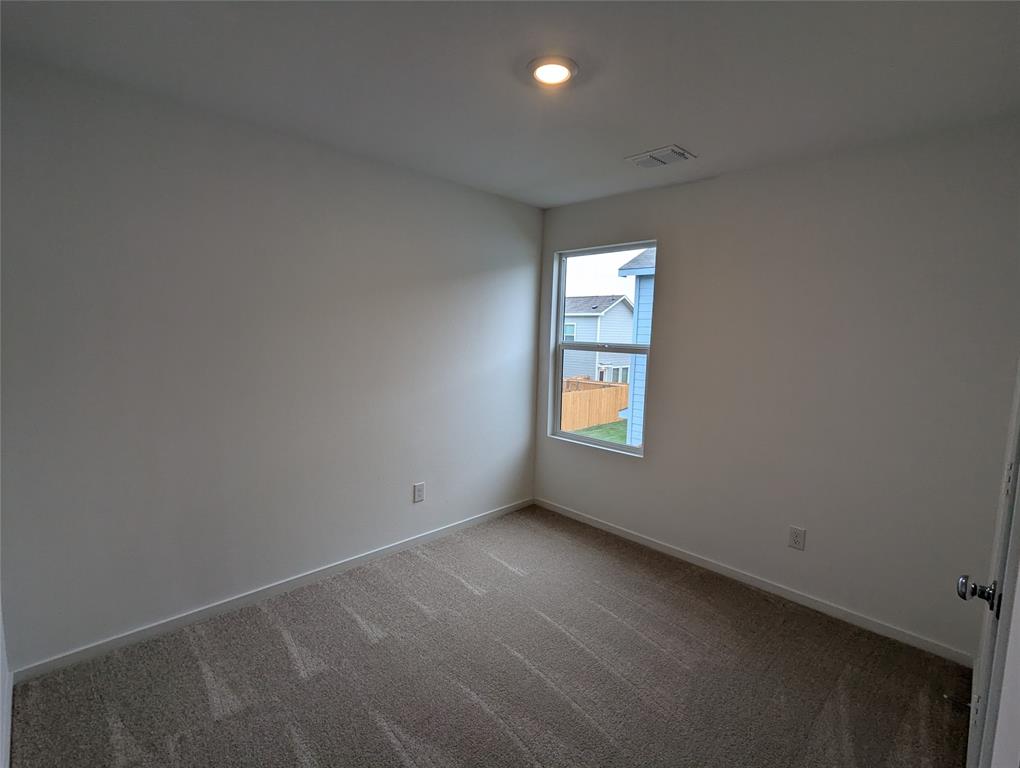 904 Wood Stork Way Princeton, TX 75407 - Photo 21 of 40 an empty room with windows