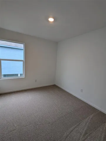 a view of a room that has a window