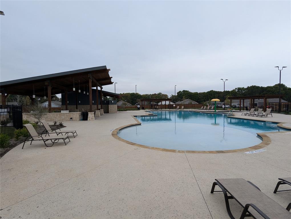 904 Wood Stork Way Princeton, TX 75407 - Photo 40 of 40 a view of a swimming pool and lounge chair