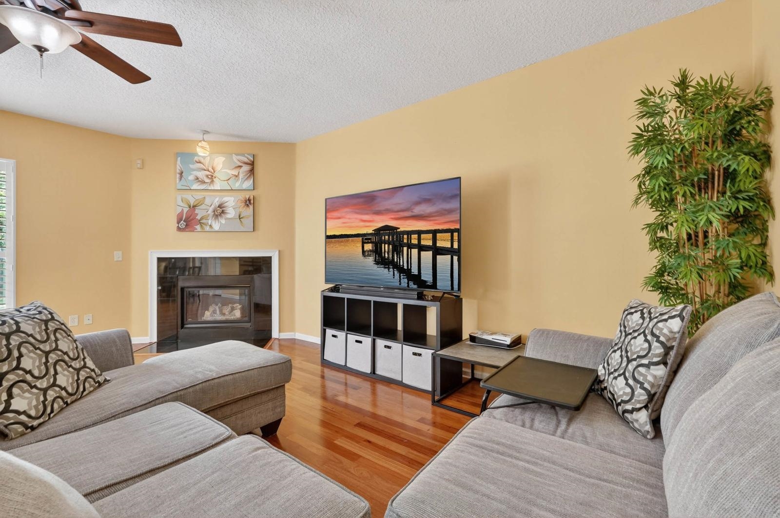1237 Splendid Ravine Street St. Augustine, FL 32092 - Photo 10 of 62 a living room with furniture a flat screen tv and a fireplace