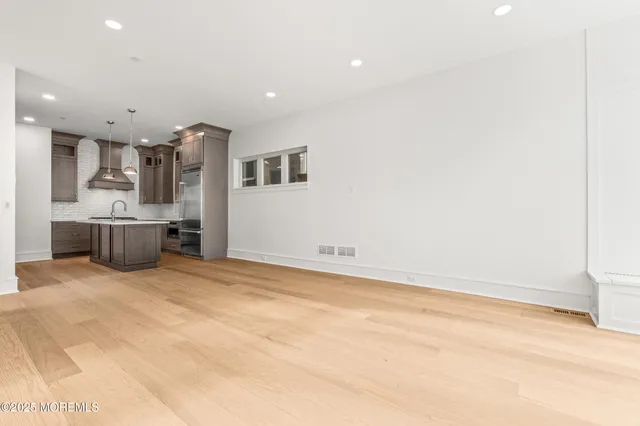 a view of kitchen and refrigerator