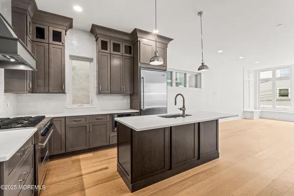 a kitchen with a sink and cabinets