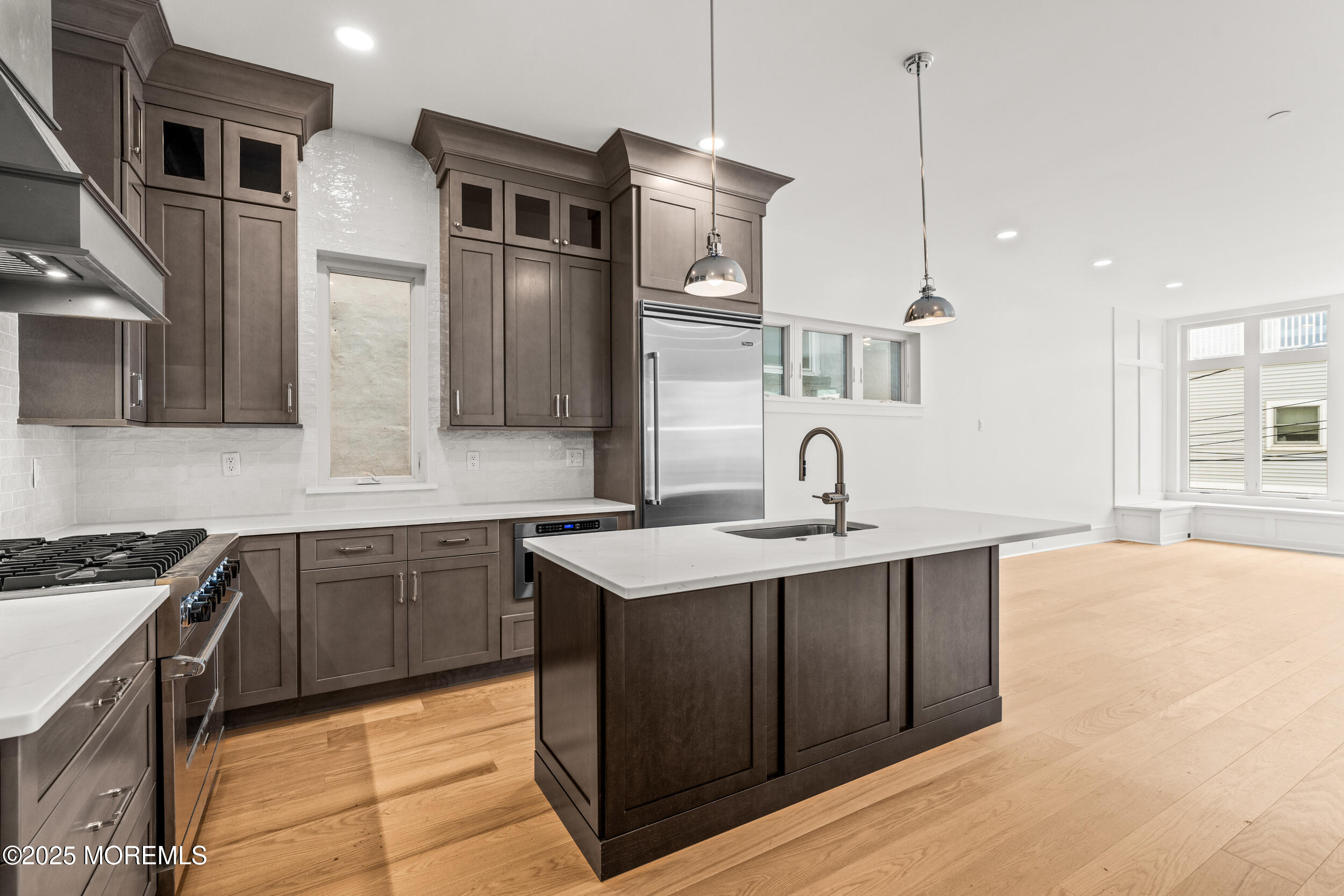 7 South Street Sea Bright, NJ 07760 - Photo 13 of 45 a kitchen with a sink and cabinets