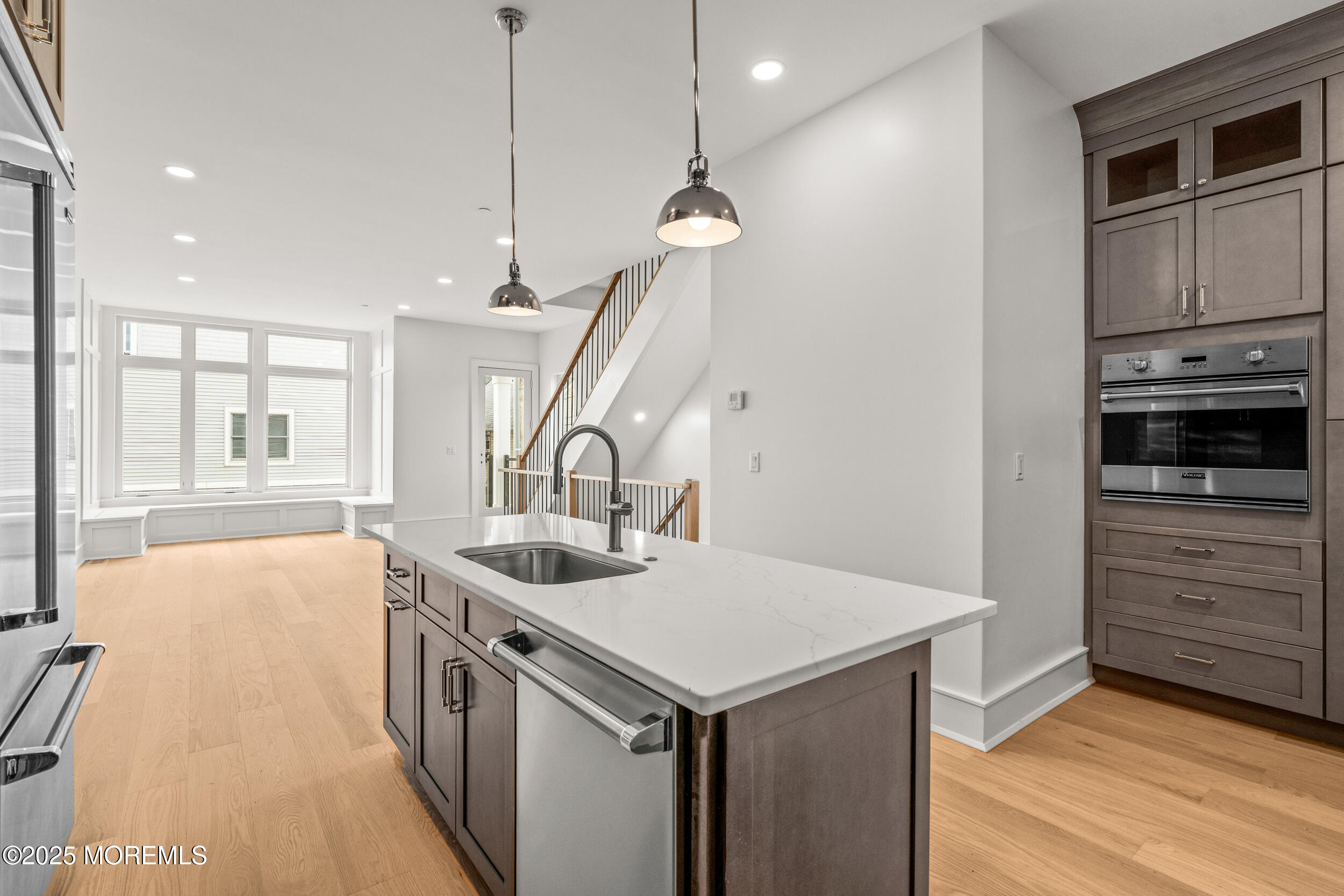 7 South Street Sea Bright, NJ 07760 - Photo 14 of 45 a kitchen that has a sink a stove and a wooden floor