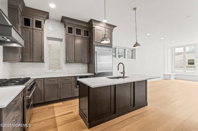 a kitchen with a sink and cabinets