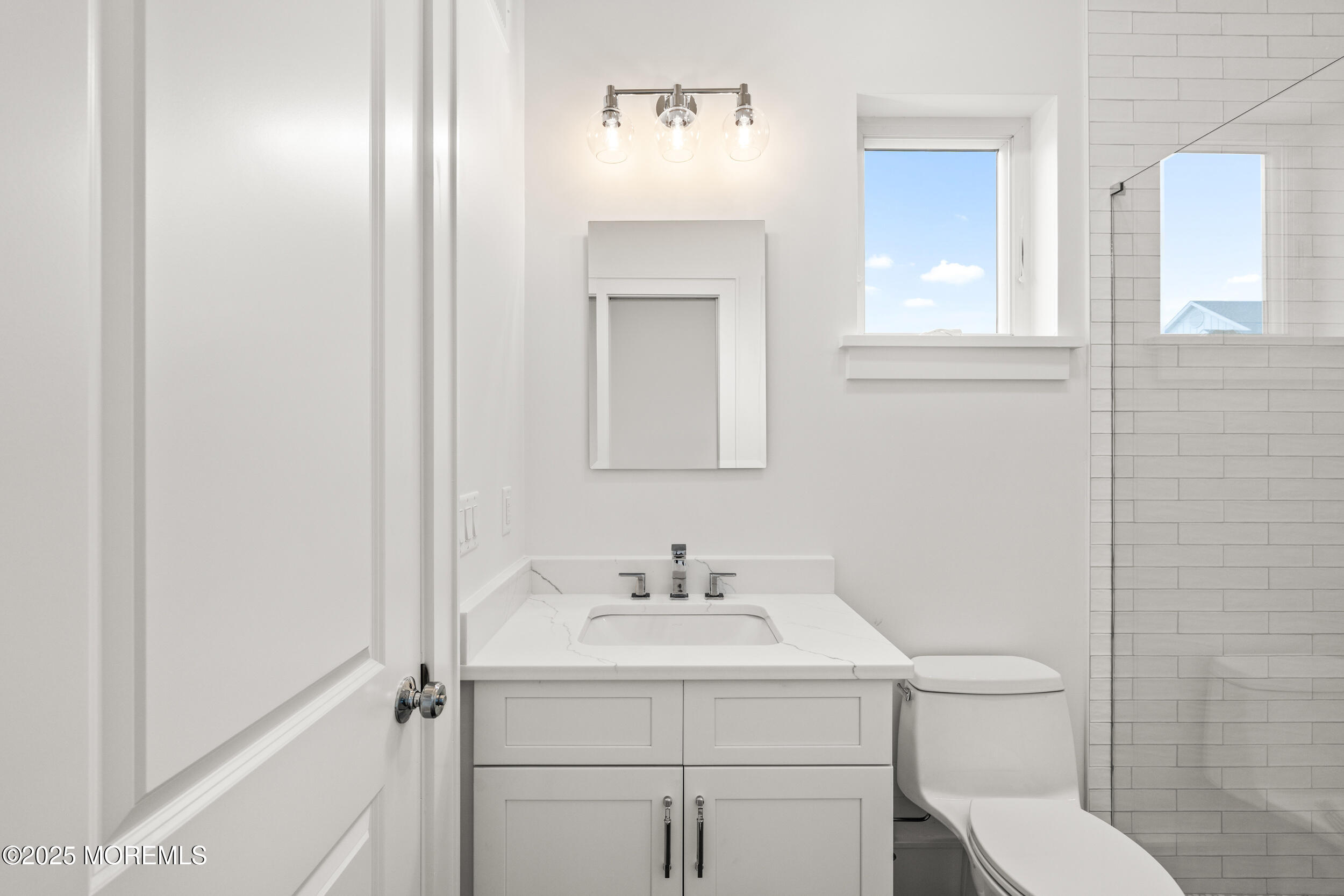 7 South Street Sea Bright, NJ 07760 - Photo 22 of 45 a bathroom with a sink toilet and vanity