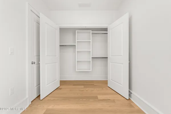 a bathroom with 2 sink and a mirror