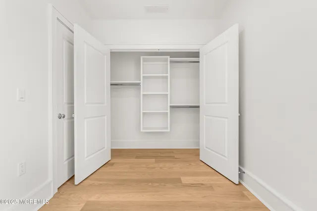 a bathroom with 2 sink and a mirror