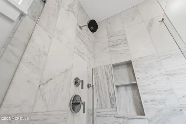a view of a room with wooden floor and windows