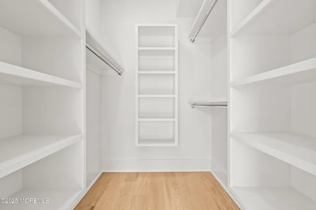 a bathroom with 2 sink and a mirror