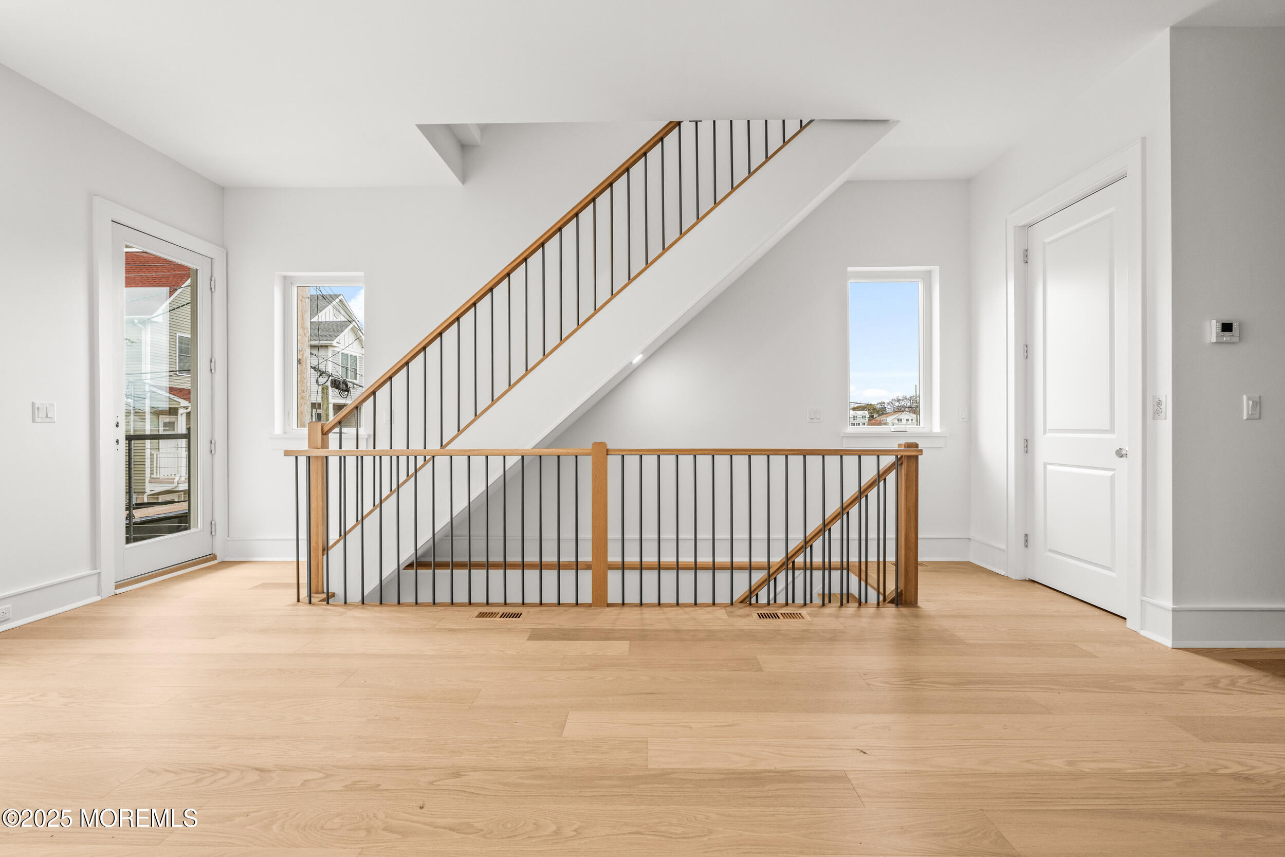 7 South Street Sea Bright, NJ 07760 - Photo 8 of 45 a view of staircase with white floor and a large window